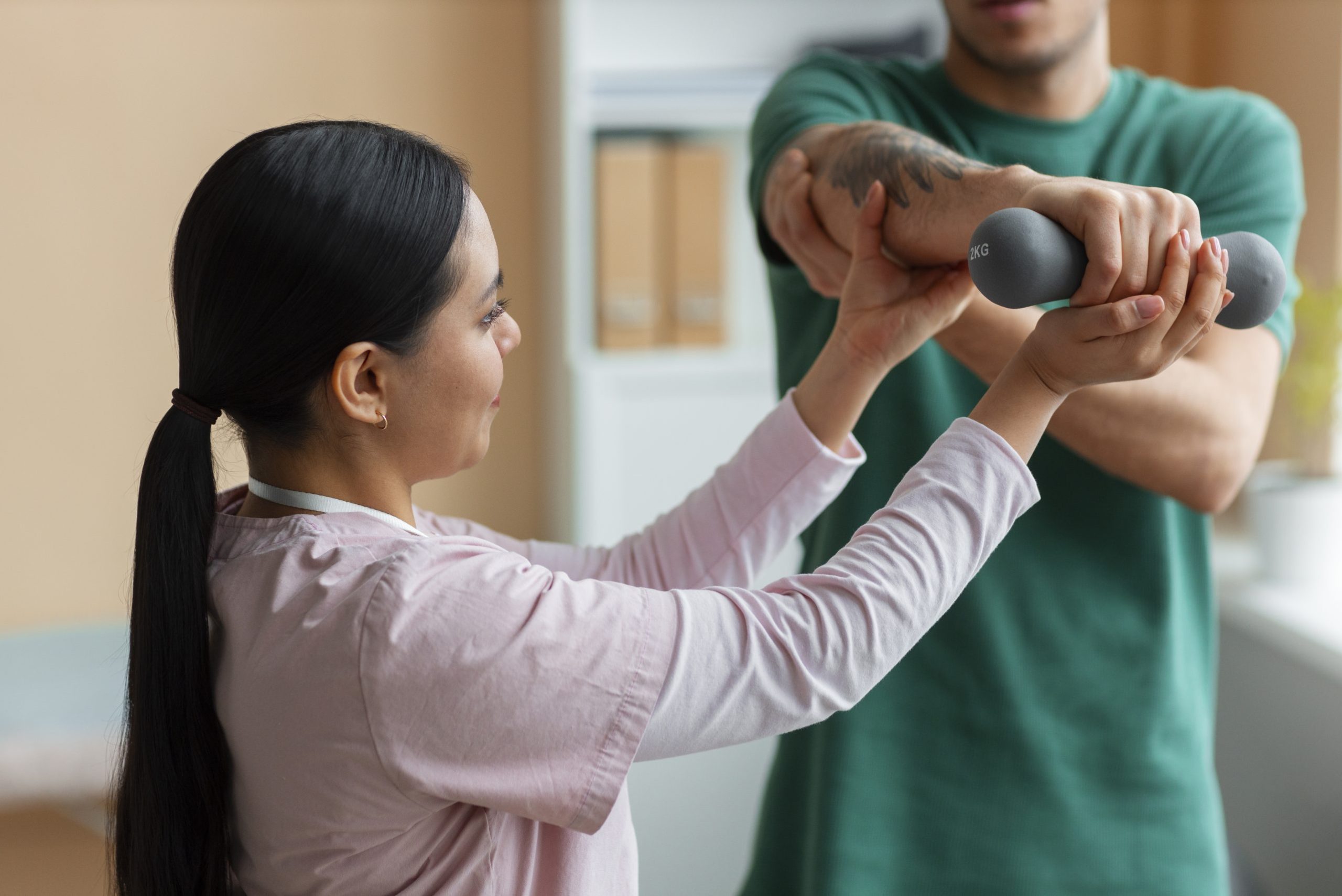 doctor-helping-patient-rehabilitation (1)