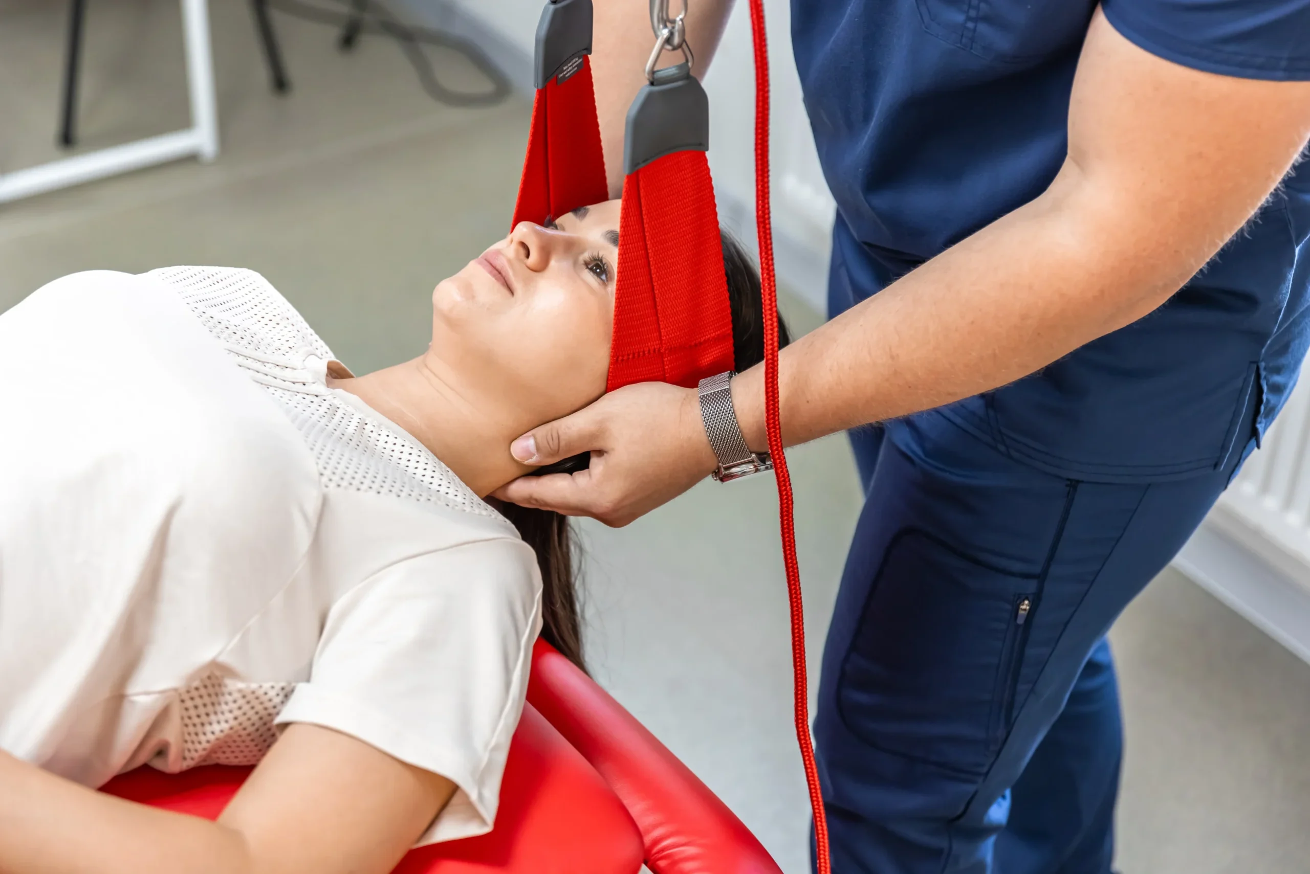 female-patient-hanging-suspensions-rehabilitation-center